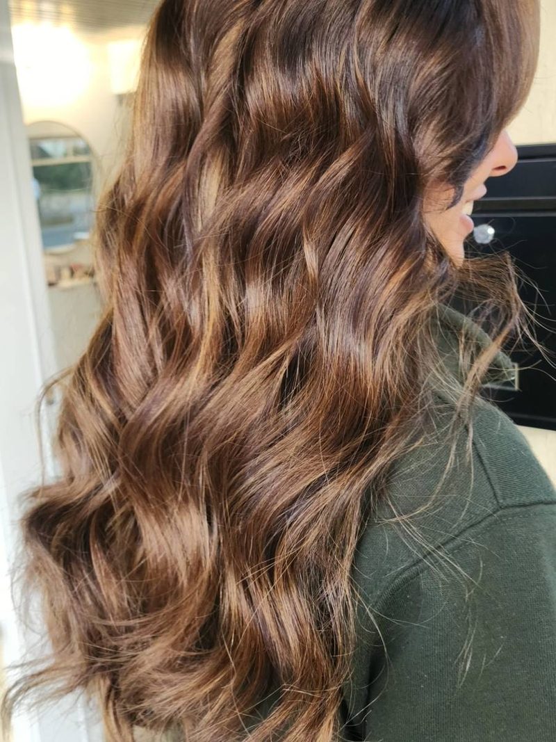 Warm brunette balayage on long waves