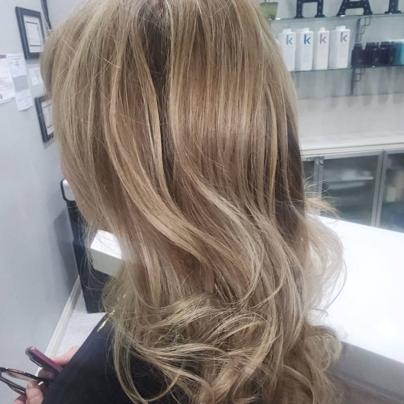 Soft beige blonde balayage on long hair