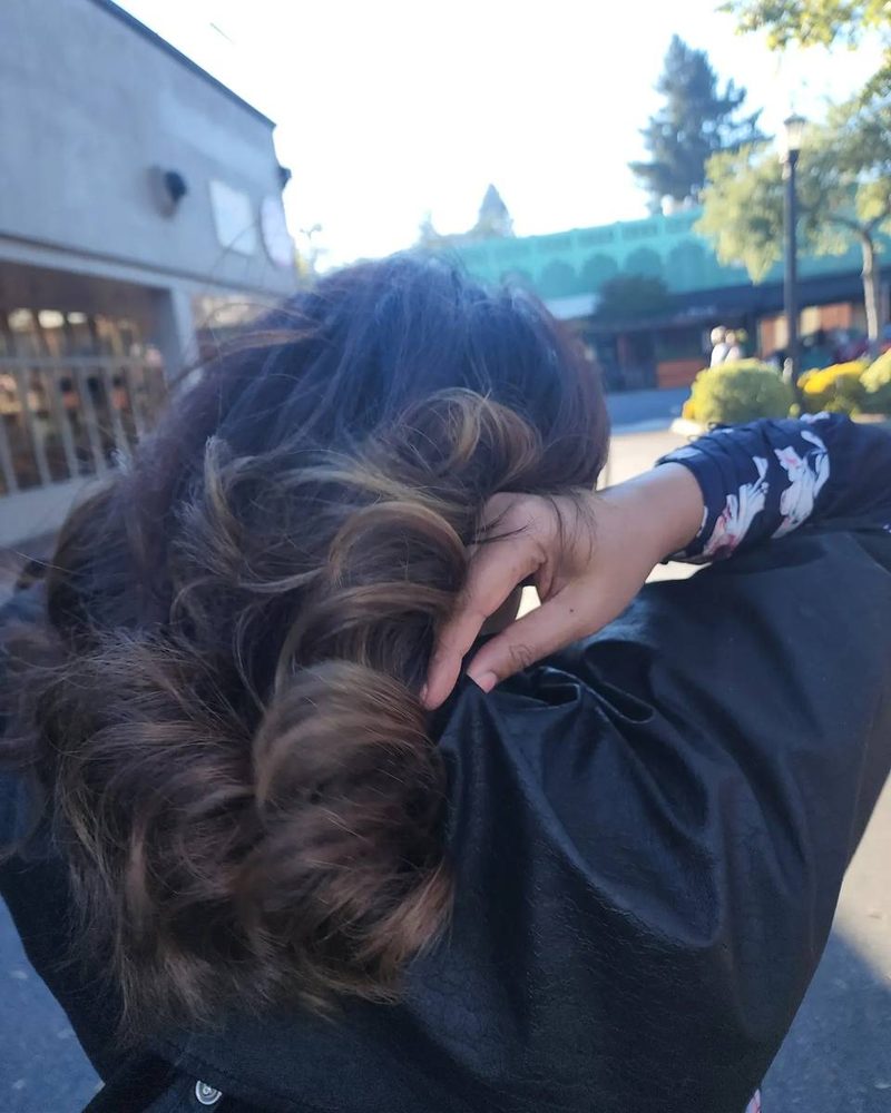 Dark brunette color with brushed out curls